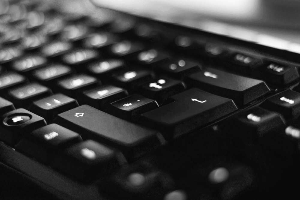 Close-up of computer keyboard with illuminated keys